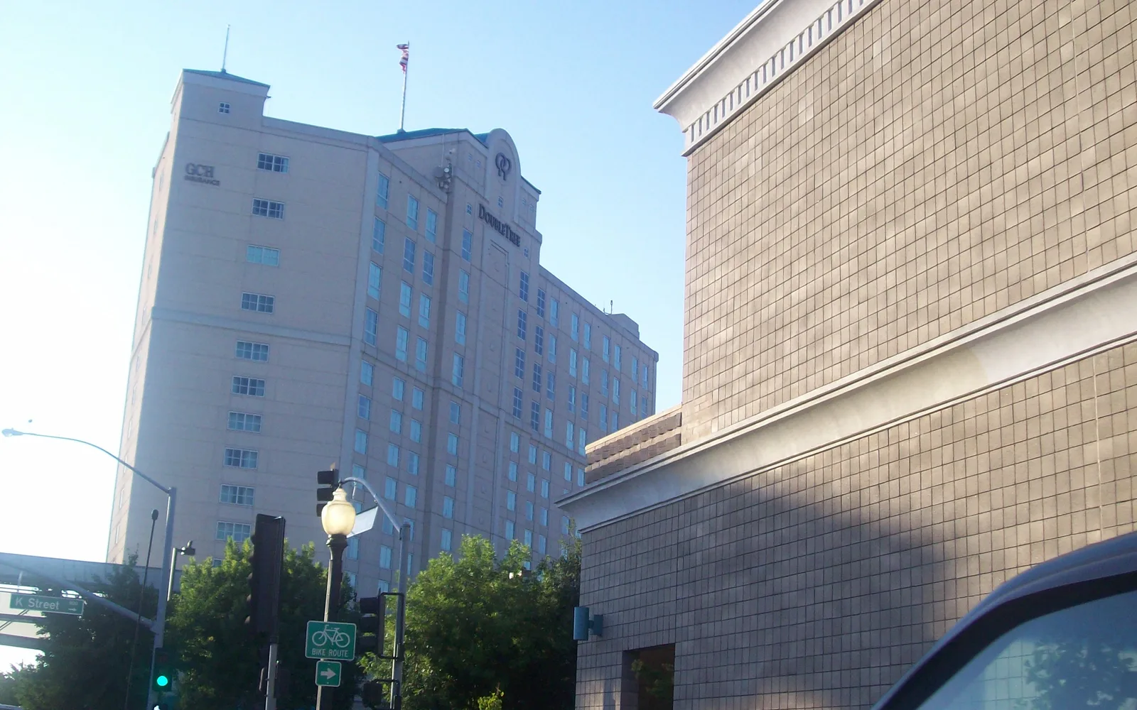 Modesto downtown street with commercial buildings and theater marquee reflecting the region's civic center